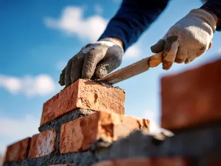 Brick being laid in mortar in Arvada